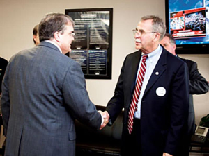 Rep. John Culberson (left) greets Dr. William Fitzgibbon, Dean of the College of Technology (right), before the presentation of the Excellence in Manufacturing Award, given by TMAC to Oceaneering, Inc. at Oceaneering's Houston office.