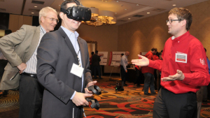 A demonstration of virtual reality for safety and emergency response training. From left: Russell Hamley, President, Associated Builders and Contractors (ABC) of Greater Houston, Ruben Mariduena, Bechtel, Brian Holtkamp, UH Researcher