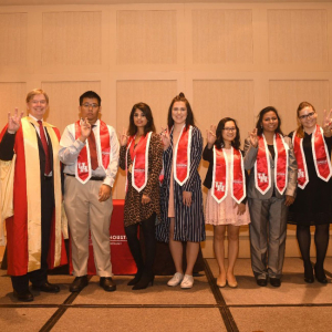 From left: Dean Tony Ambler with banner bearers - Steven Pan, Sanober Naz, Emily Brown, Evelynn Nguyen, Nelufa Islam, Juliane Rozin.